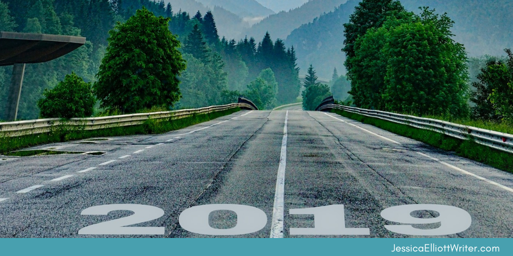 Tree-lined highway with guard rails and trees with 2019 imprinted in white. Prepare for your year-end writing reflection.