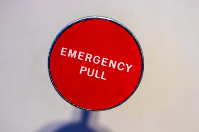Red emergency pull button suggesting that restaurant marketing plan must include crisis communications.